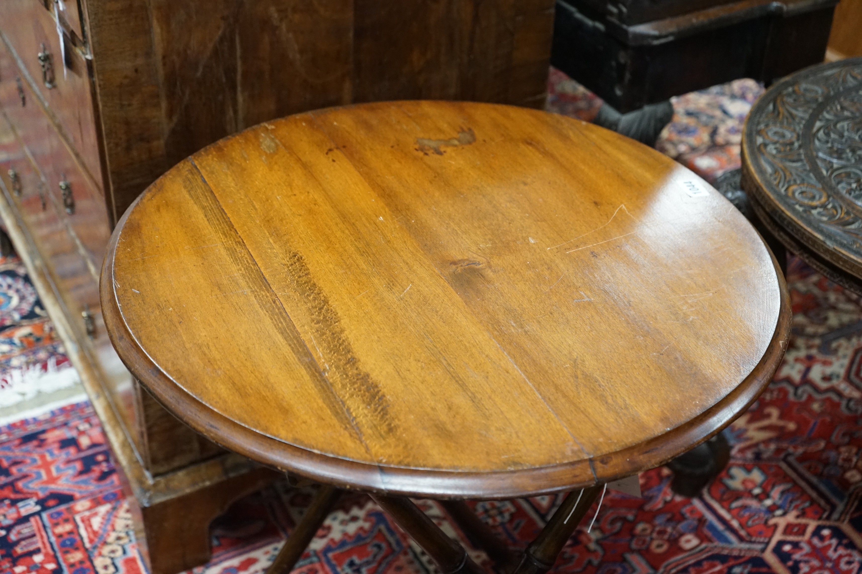 An early 20th century circular beech folding occasional table on faux bamboo underframe, diameter 60cm, height 70cm